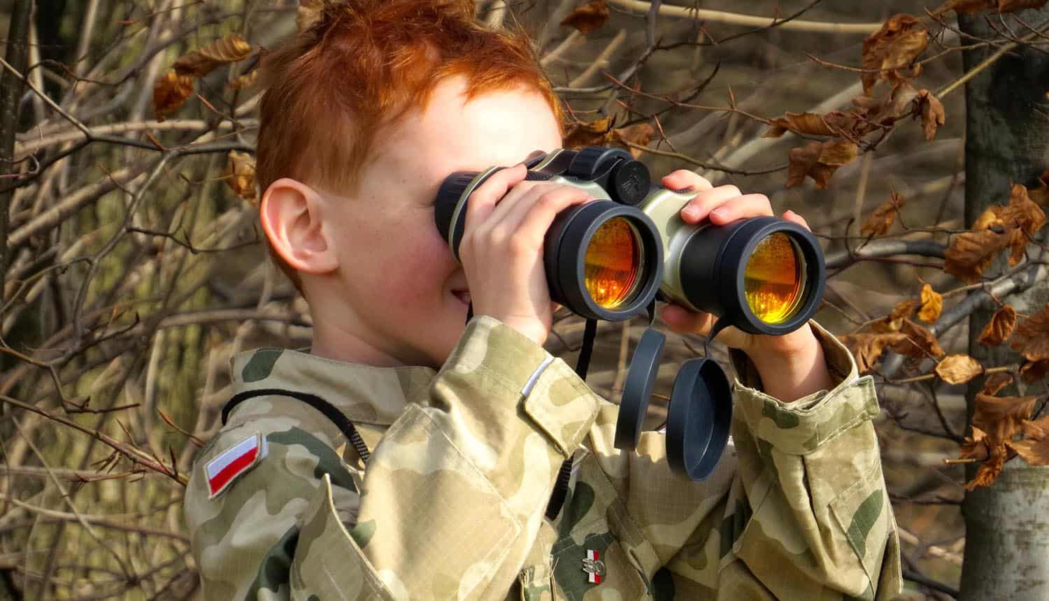 Image of boy using binoculars representing companies watching their data