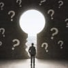 Image of man standing in from of keyhole with questions representing the unknowns in terms of development in Indonesian privacy rules