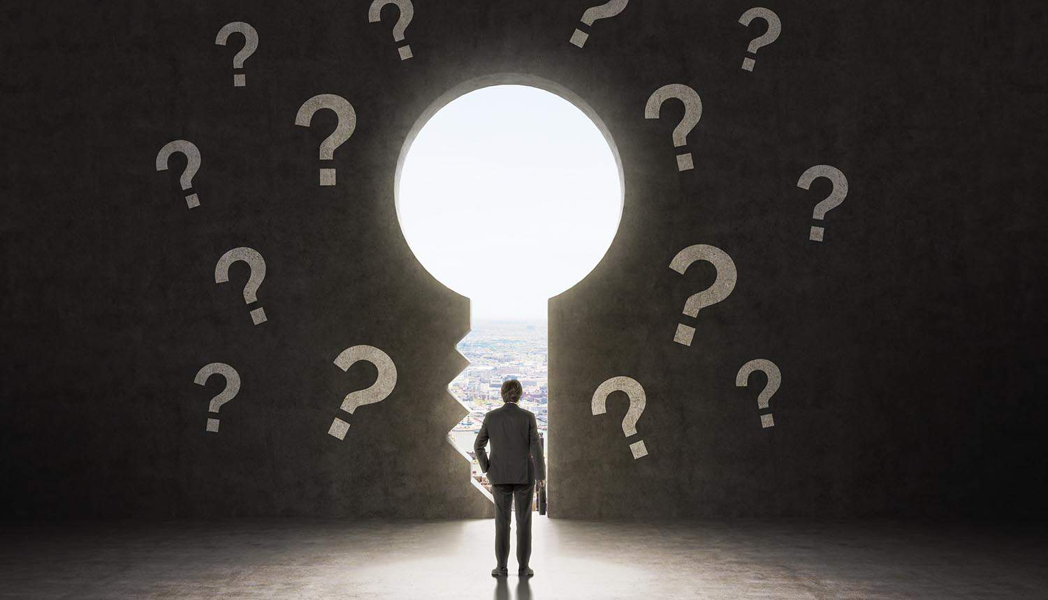 Image of man standing in from of keyhole with questions representing the unknowns in terms of development in Indonesian privacy rules