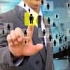 Image of man using finger to select a person in a network representing difficulty of employers finding the employee privacy sweet spot