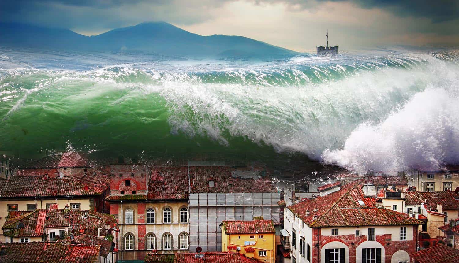 Image of a massive wave engulfing a city signifying the intensity surge in DDoS attack trend