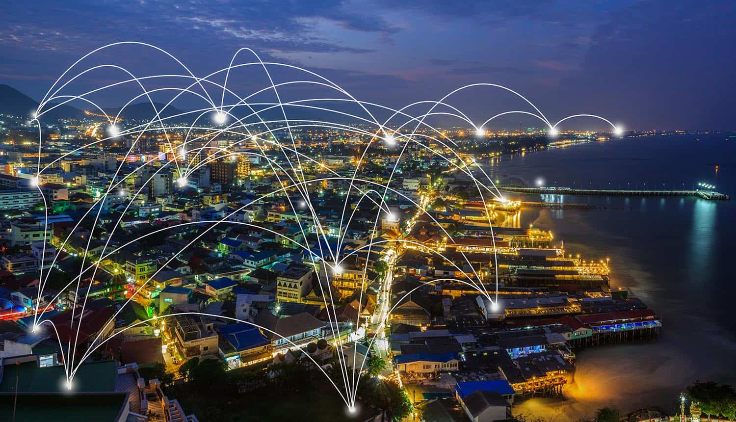 Image of city at night with lighted network connections signifying the danger of the latest WPA2 Wi-Fi security flaw