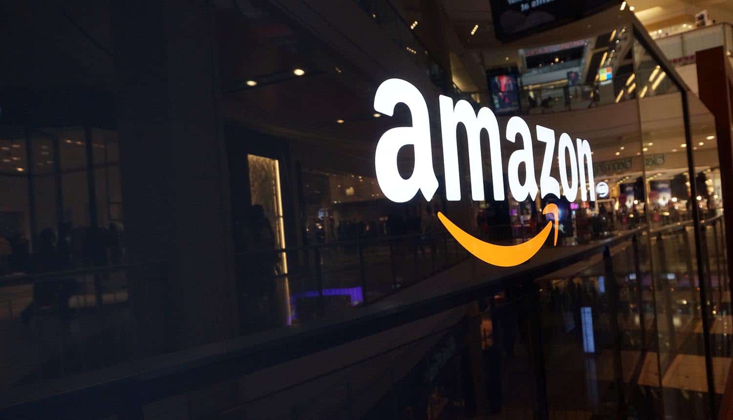 Image of Amazon logo on a shop window signifying the hacking and insurance risks issues for Amazon Key