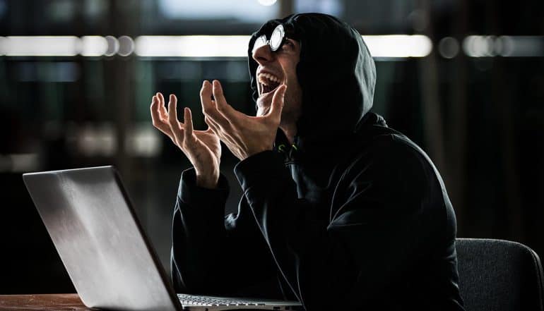Image of hacker laughing representing not letting a good data breach go to waste