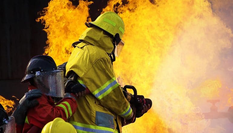 Image of firemen putting out a fire representing cyber incident response