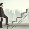 Image of business executive walking up stairs representing steps for security experts to gain privacy perspective, from CISO to CPO