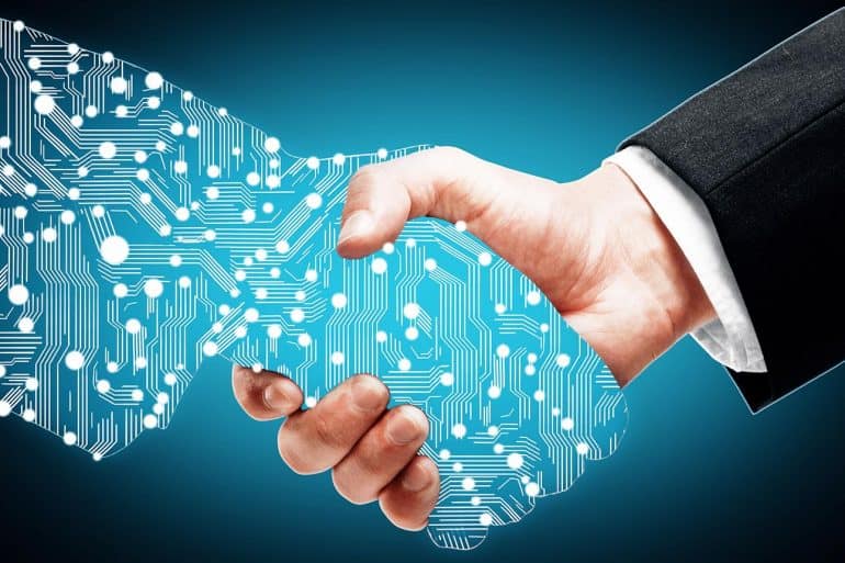 Image of man shaking hands with a electronic being signifying the privacy and legal issues of artificial intelligence
