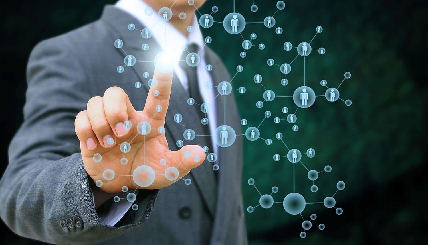 Image of man using his finger to select a person in a network showing how privacy might not be dead but may be difficult to get it back