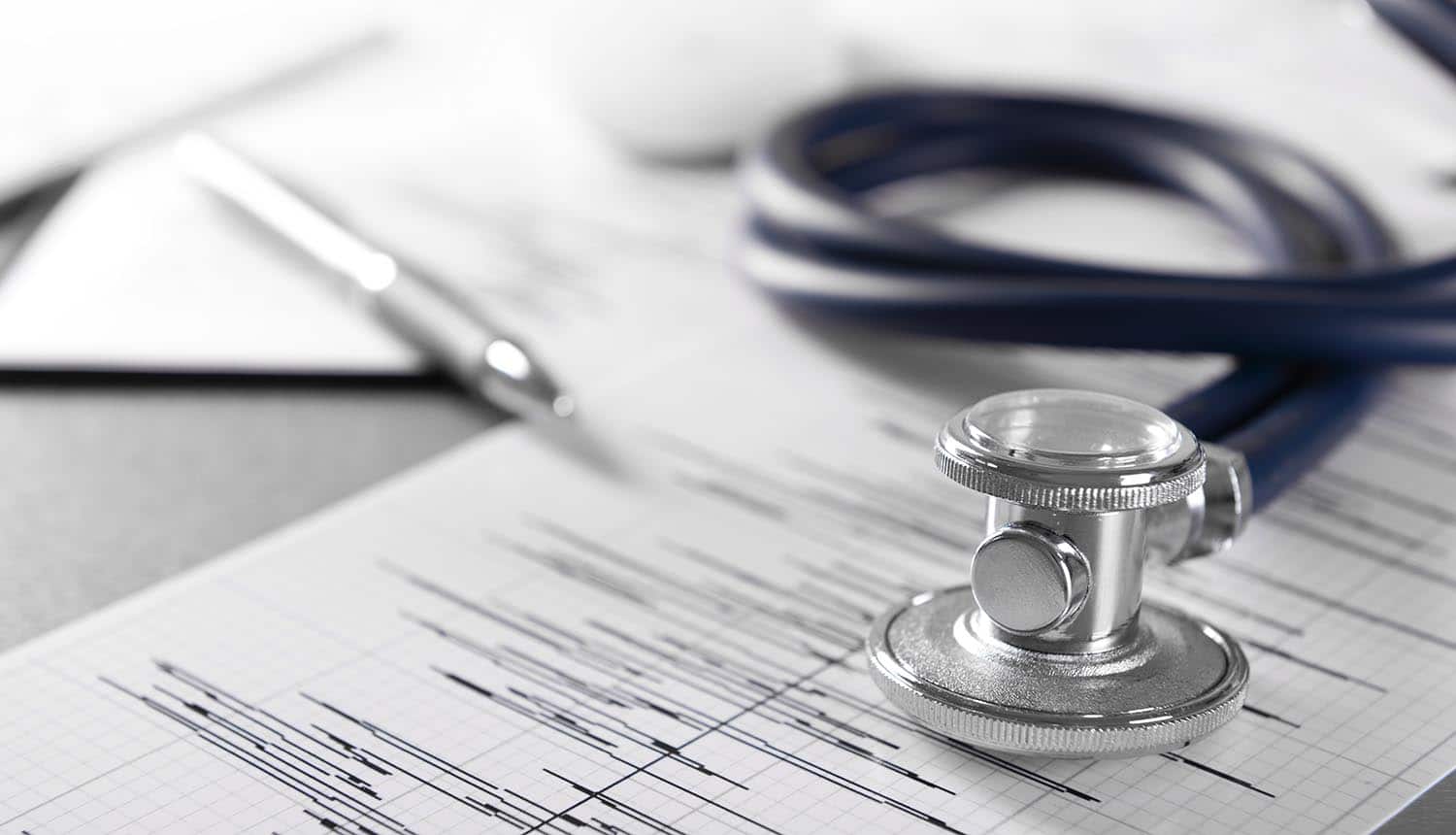 Image of stethoscope on heartbeat chart showing how privacy management software is needed