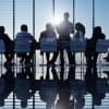 Image of great leadership instead of analyst firms in a boardroom making cyber security decisions