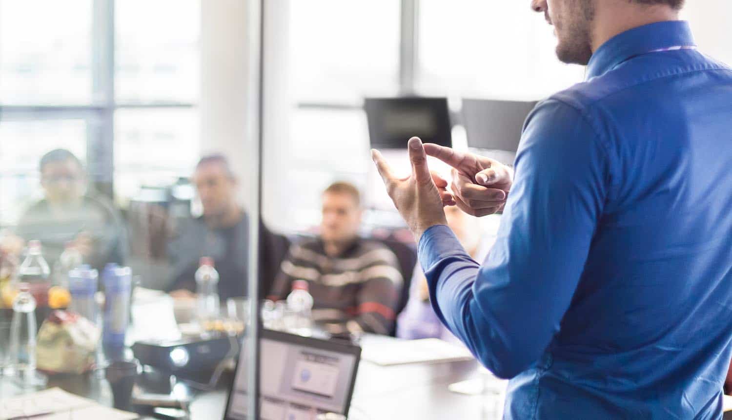 Business executive delivering a training presentation to employees