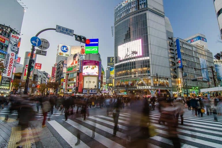 Blurred crowd crossing street in a smart city with concept of access control