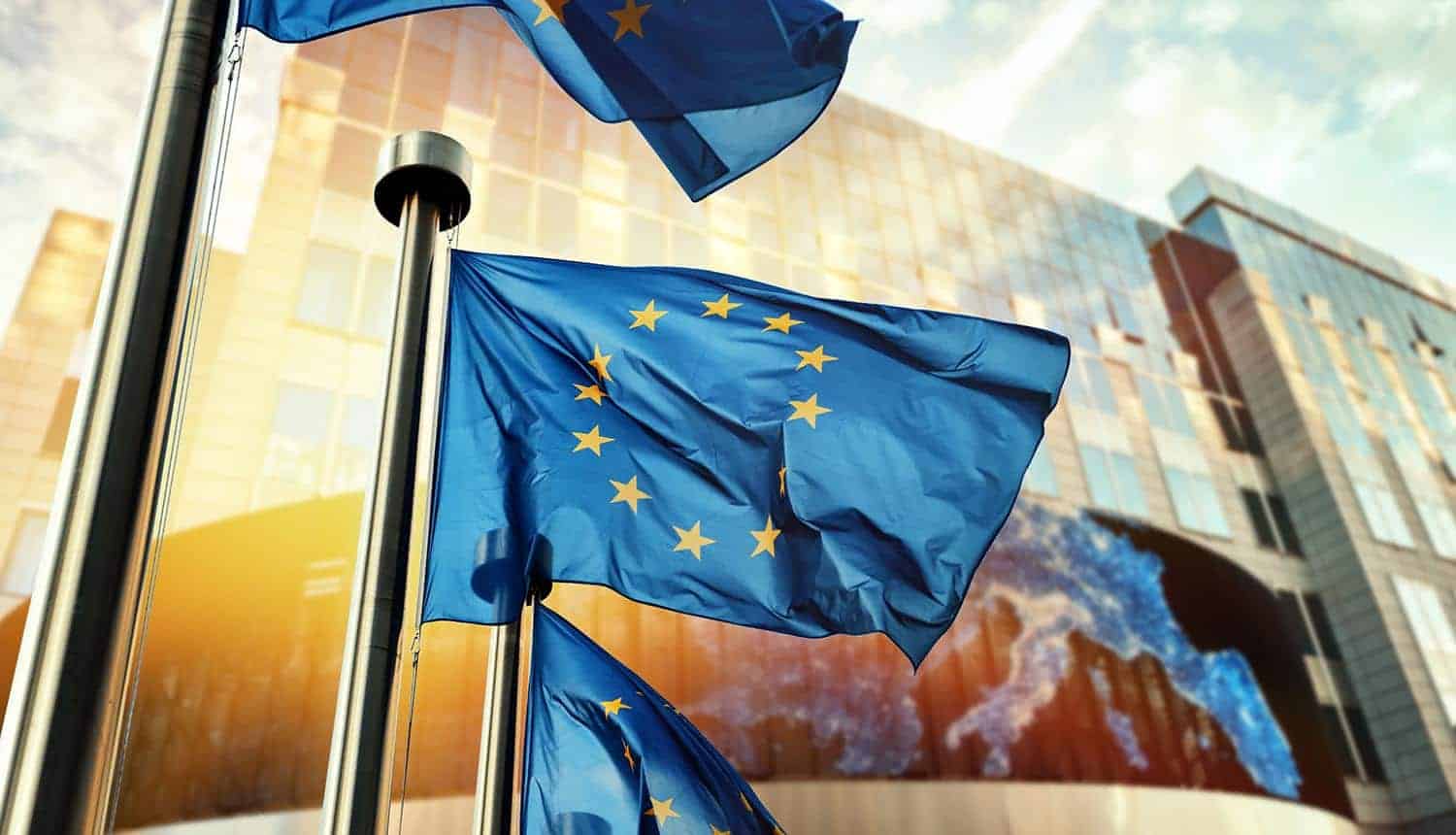 EU flags waving in front of European Parliament building