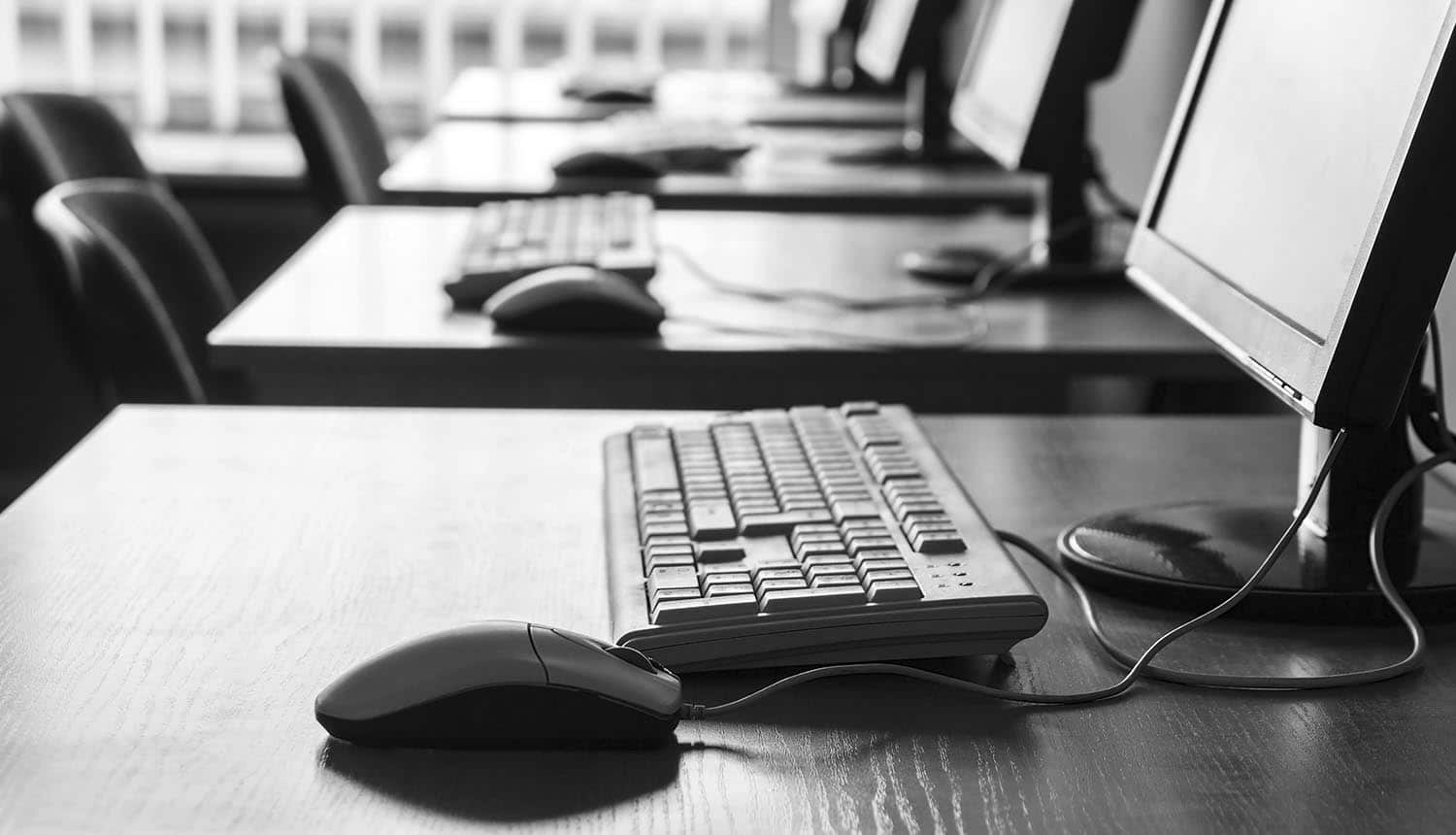 Computers in office with empty seats for cybersecurity training and how the human-factors is still valuable