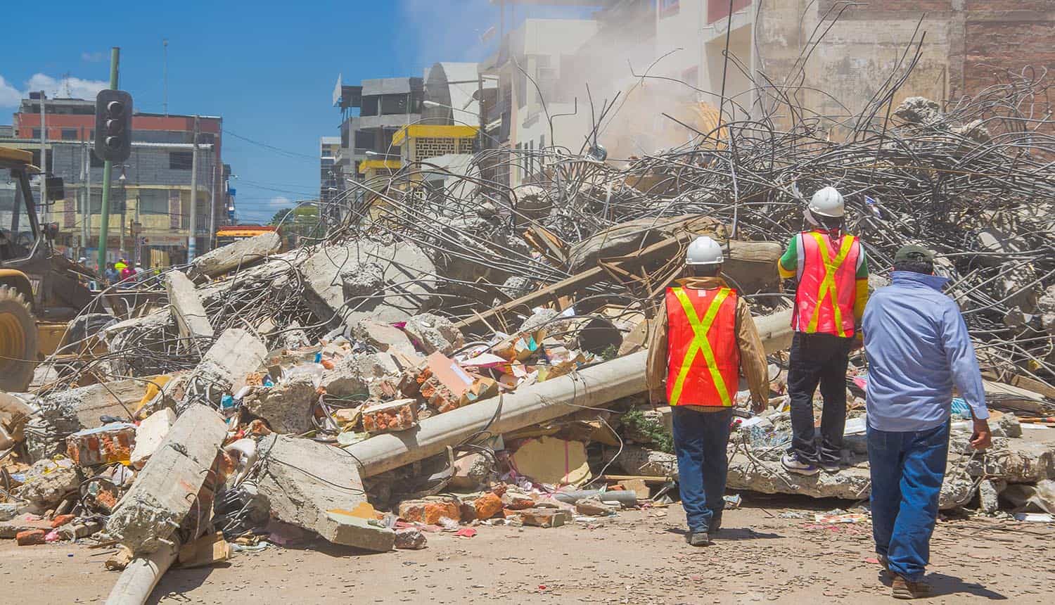 Rescue team making recovery efforts after earthquake showing importance of data recovery and protection planning