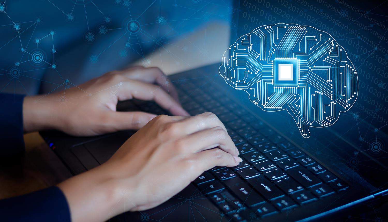 Man typing on a keyboard programming artificial intelligence posing the threat of AI to cybersecurity