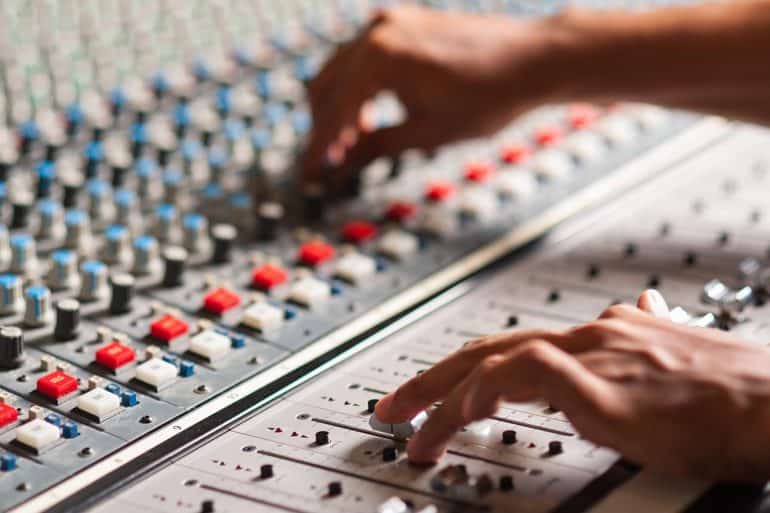 An expert adjusting controls on a console showing the need for a clearinghouse for data brokers