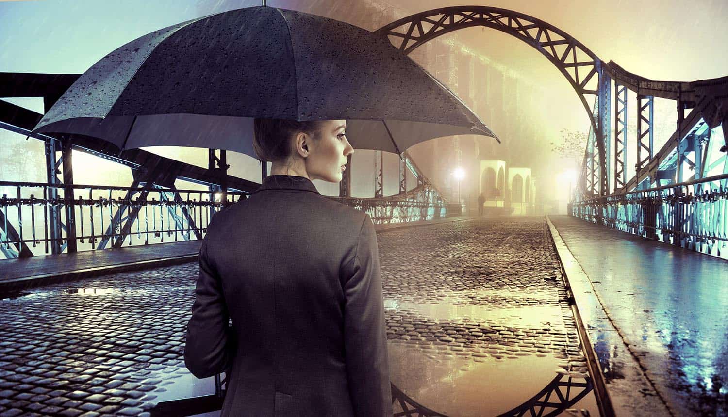 Businesswoman standing in the rain holding umbrella showing that cyber insurance coverage may not be what was expected