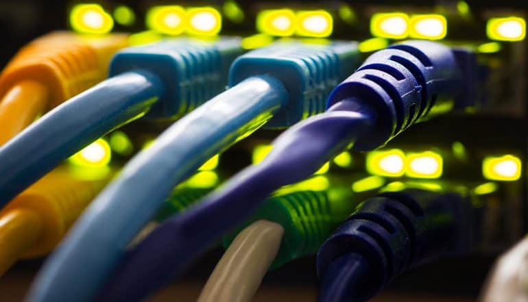 Network cables plugged into a switch hub showing Russia Internet control to unplug