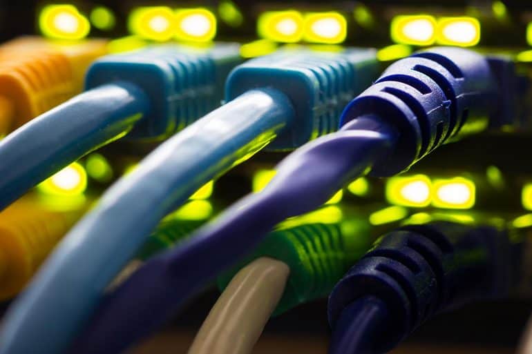 Network cables plugged into a switch hub showing Russia Internet control to unplug