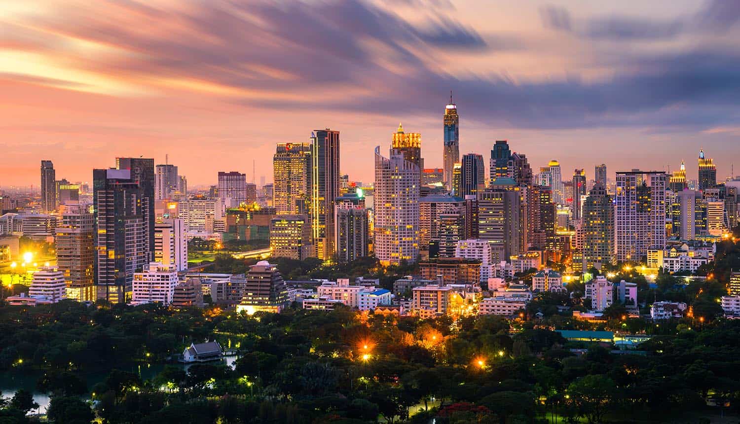 Bangkok city skyline downtown and clouds at sunset showing impact of new Thailand cybersecurity law