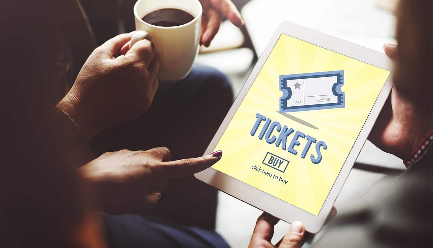 Woman buying tickets using iPad showing the new formjacking threat