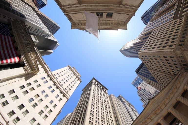Fisheye view of Wall Street buildings in New York City USA showing need for financial services firms to pay attention to CCPA