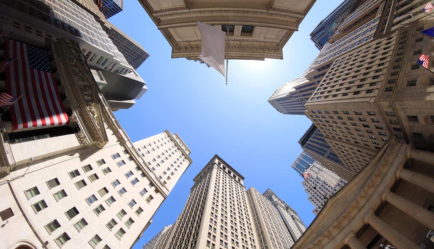 Fisheye view of Wall Street buildings in New York City USA showing need for financial services firms to pay attention to CCPA