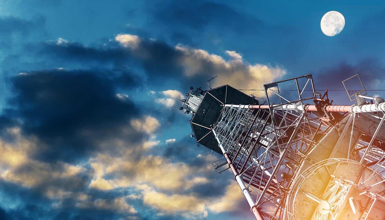 Telecommunications tower against dark sky showing Huawei's challenges