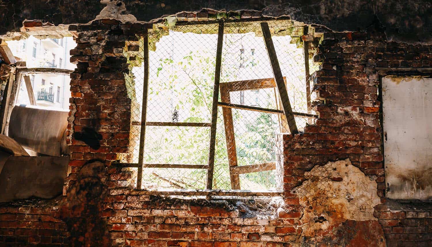 Inside ruined abandoned house building after disaster showing the impact of data breach on disaster survivors