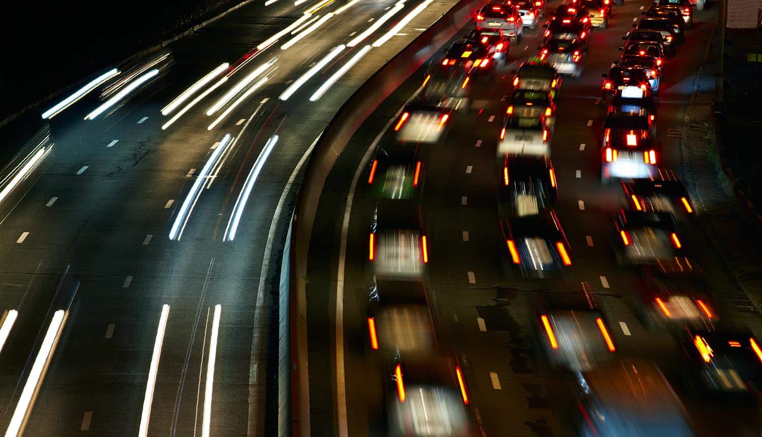 Car lights in fast and slow lanes showing reinstatement of Net Neutrality rules to allow a free and open Internet