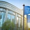 European union flag against parliament showing cybersecurity challenges released in new briefing paper by European Court of Auditors
