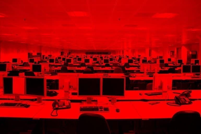Computers in IT service provider office showing vulnerability for supply chain attacks
