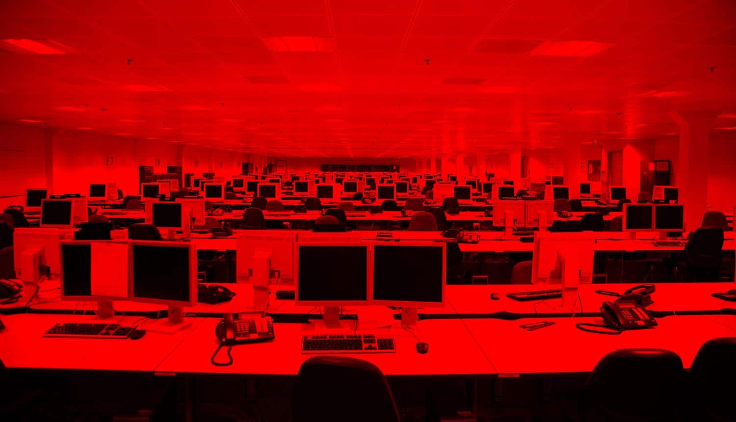 Computers in IT service provider office showing vulnerability for supply chain attacks
