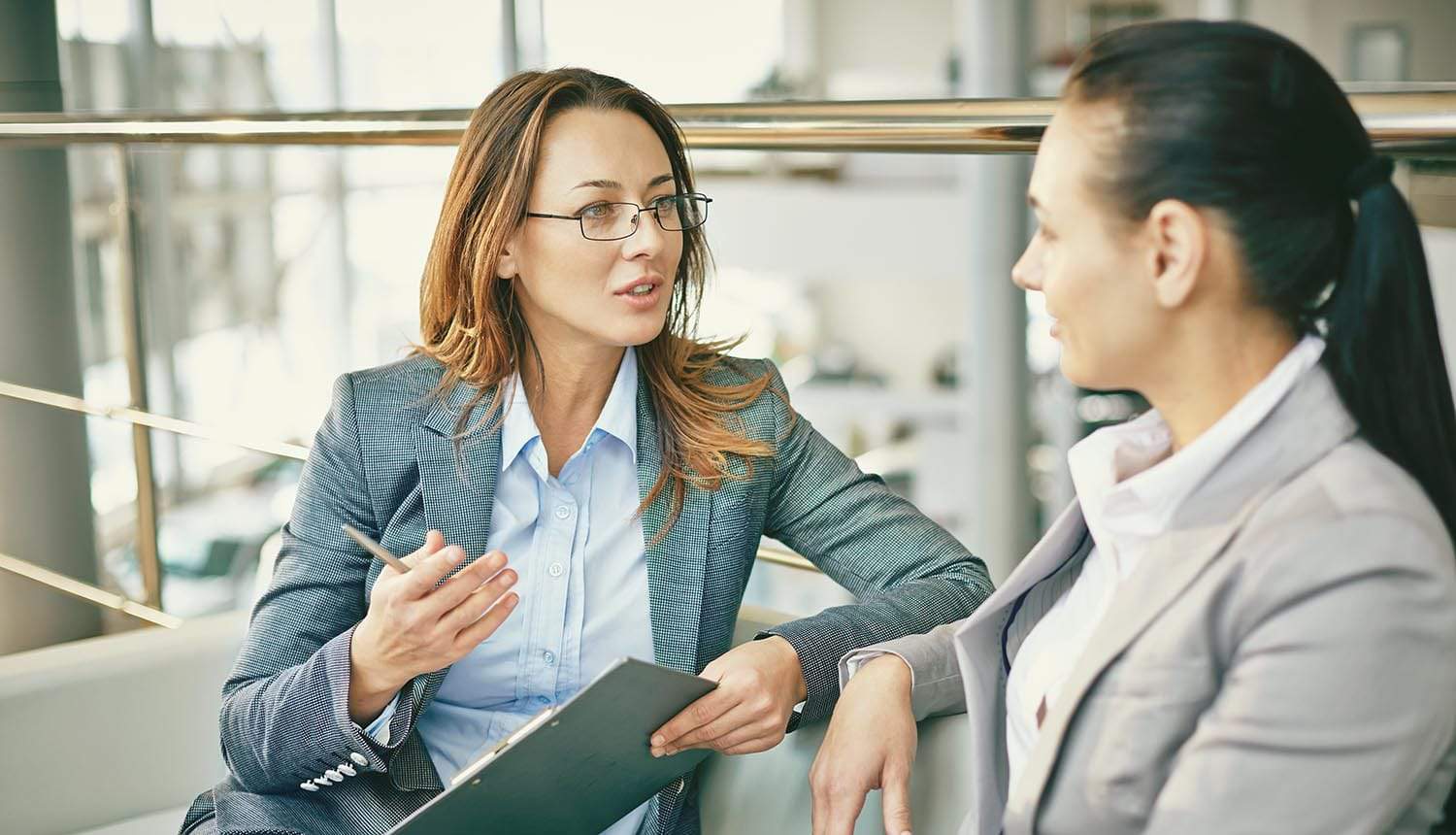 HR manager speaking to employee showing HR playing an important role in data protection