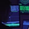 Hacker working on computer showing new wave of hacking through AI-powered malware, smart phishing and open source attacks