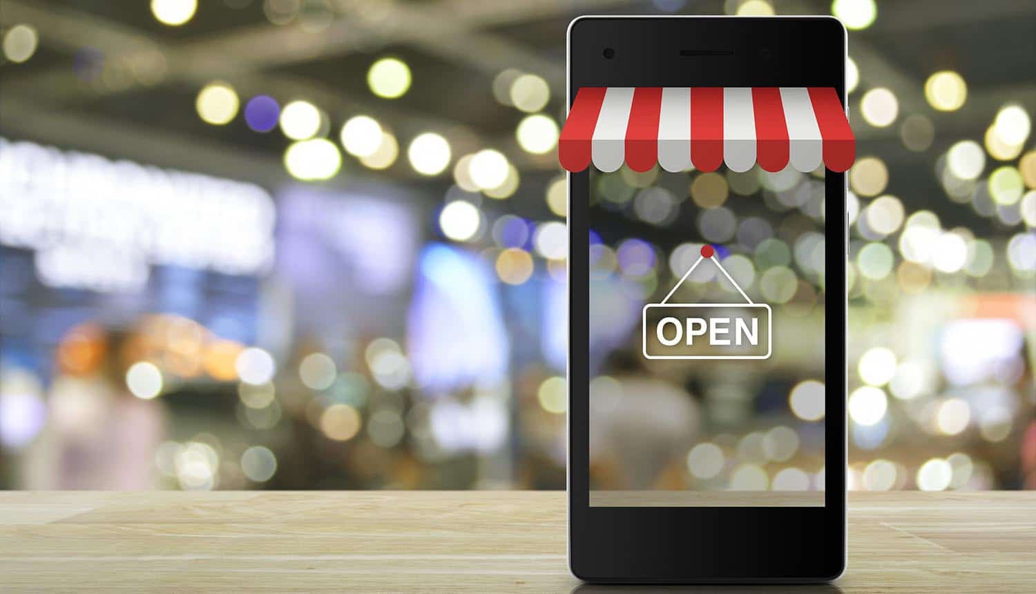 Online shopping logo on mobile phone showing the broadening of supply chain attacks by Magecart cybercrime group