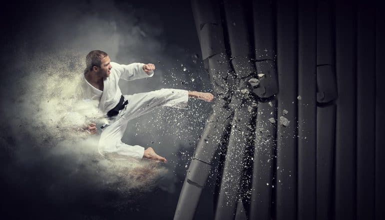 Karate man breaks wall showing Israel's cyber response using missile strike
