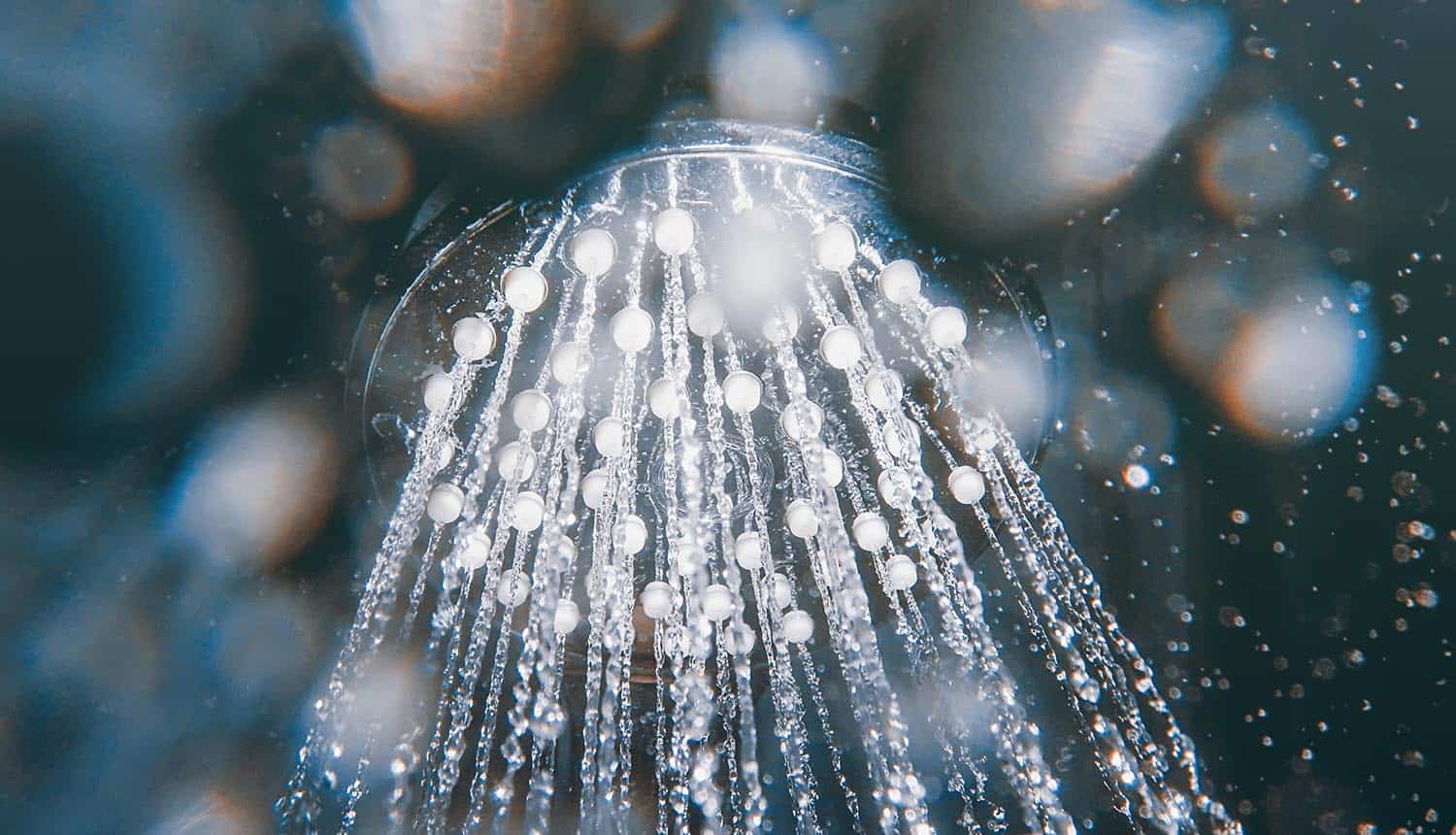 Shower head with flowing water showing the data leak of 900 million records at First American