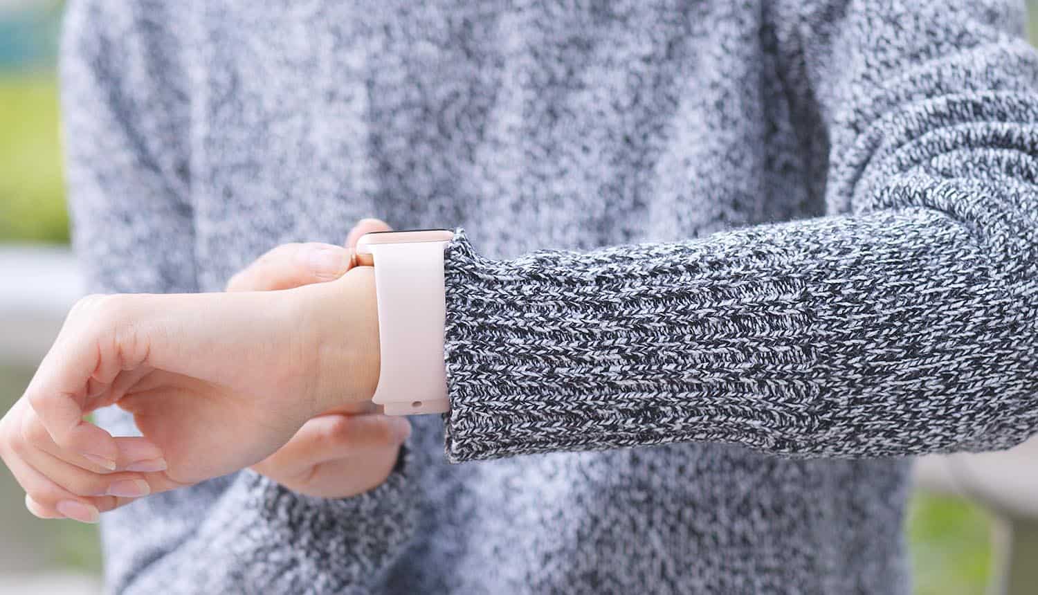 Woman using smart watch showing how identity signals could help to address data privacy concerns of connected devices