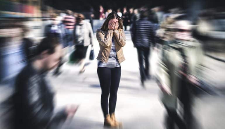 Woman having panic attack on the street showing the privacy concerns over Amazon’s new facial recognition capability to read fear on human faces