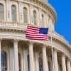 U.S. flag flying outside capitol building showing election security currently taken as high priority issue in U.S.