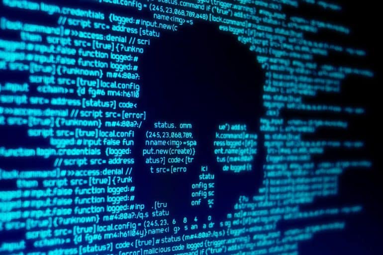 Computer code on a screen with a skull showing researchers using a few simple strings in code to trick Cylance antivirus into thinking malware as trusted software