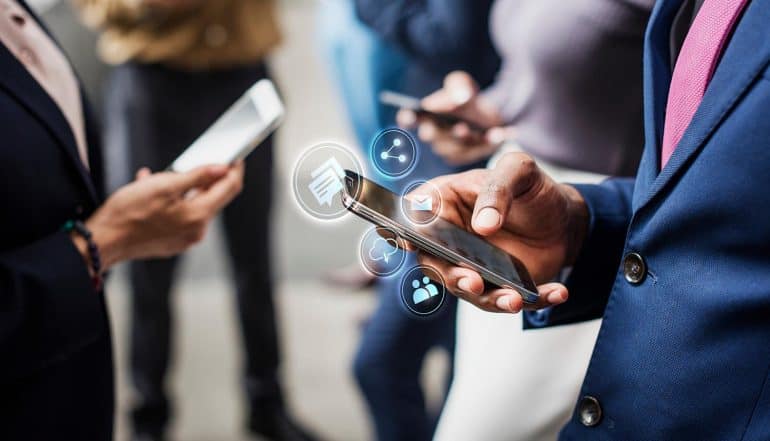 Businessmen using mobile phones showing how Dashboard Act keeps U.S. on the frontlines of data privacy even though NYPA fails to pass legislation