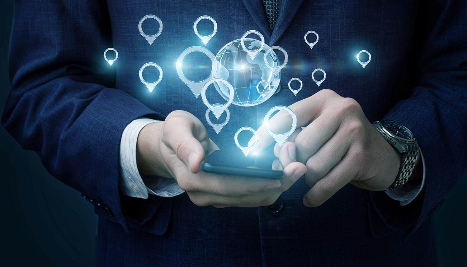 Man defining his location on mobile phone showing new feature in iOS 13 to warn about apps collecting location data