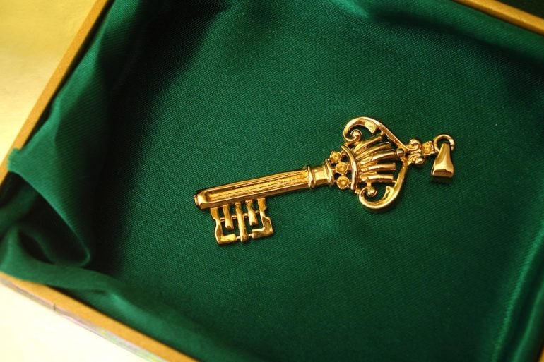Golden key on green box showing the new controversial treaty between U.S. and U.K. which could force social media companies to create encryption backdoor