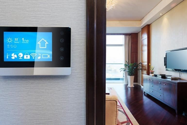 Smart home app on screen in living room showing new IoT privacy issues raised on smart devices leaking data to tech giants