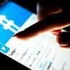 Woman using Twitter on tablet showing the Twitter privacy breach which served up targeted ads to users
