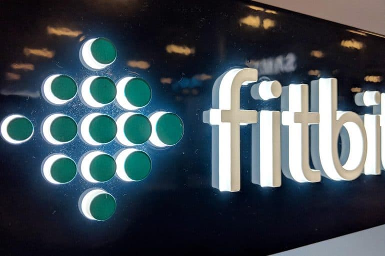 Fitbit logo on shop front showing the implications for health and fitness data from Google’s acquisition of Fitbit