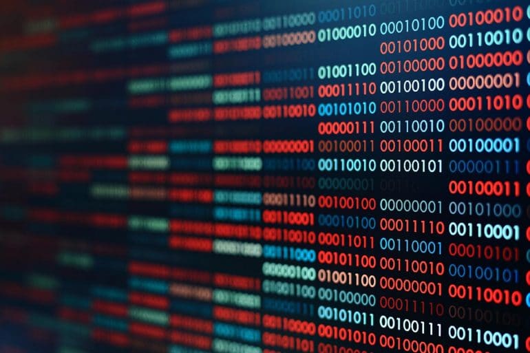 Screen with binary code showing the challenges in collecting and protecting personal data